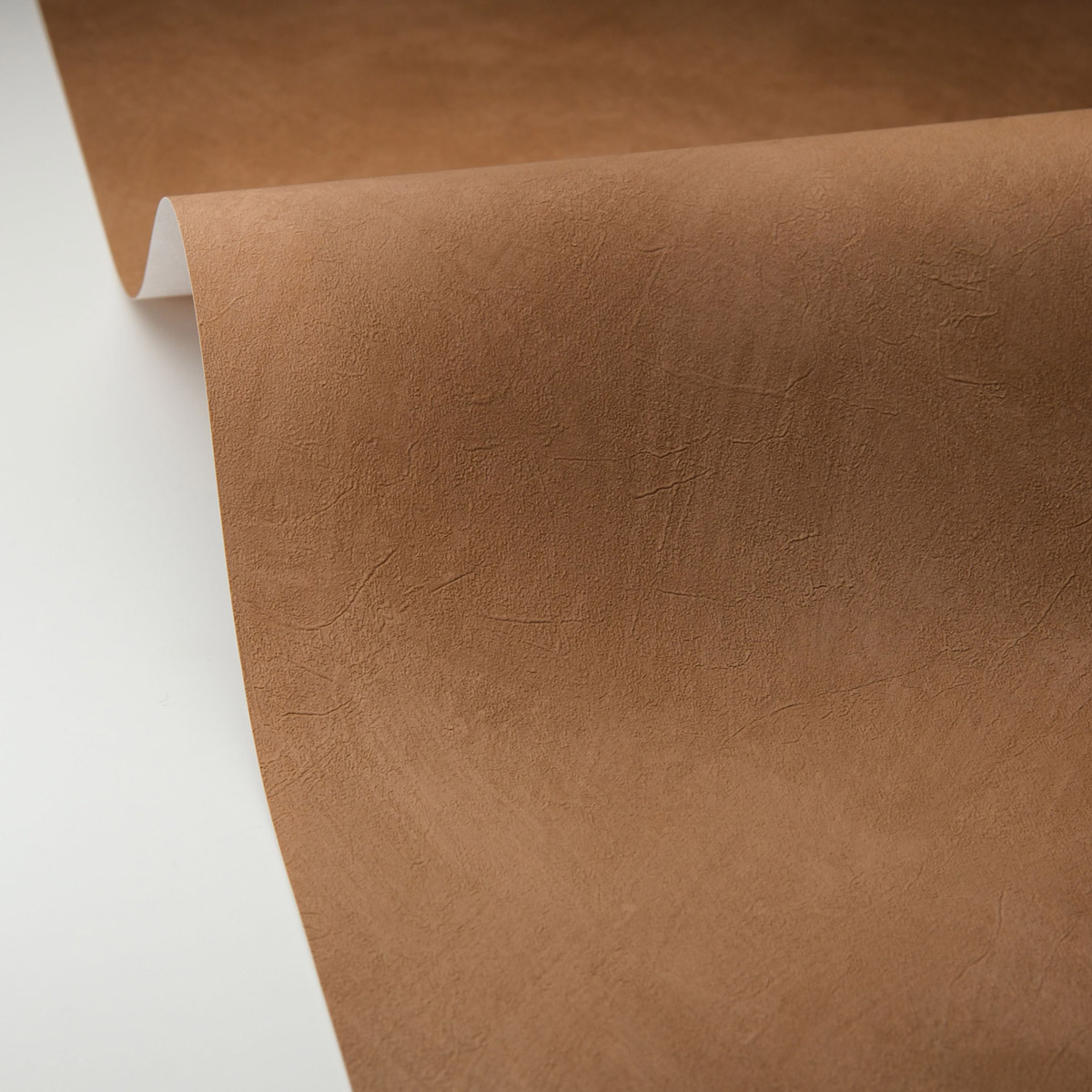 Papier peint Uni Enduit La Chaux marron - Origine de Casélio AMB5| Réf. OGN106082051