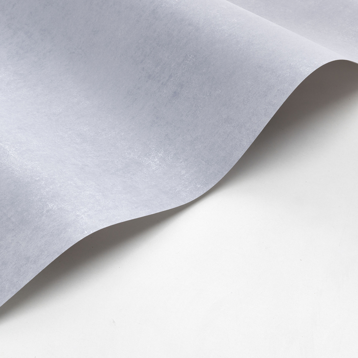 Papier peint Faux Uni Stone bleu perle et irisé - Voyage Onirique de Casadéco | Réf. ONIR80839240